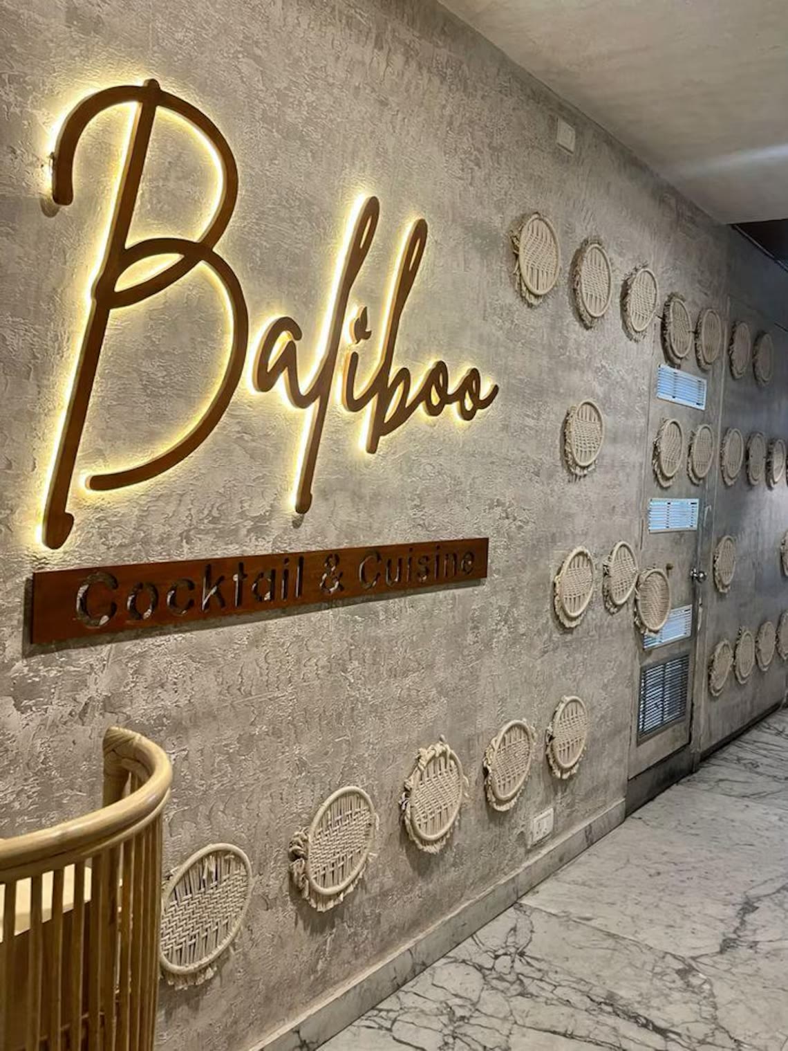 Warm halo backlit metal script letters in a restaurant