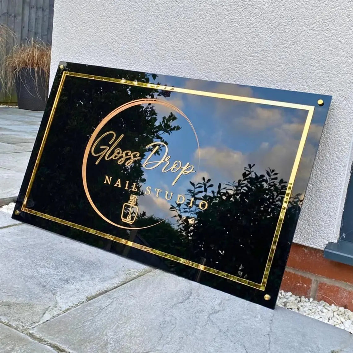 Laser-cut metal panel business sign